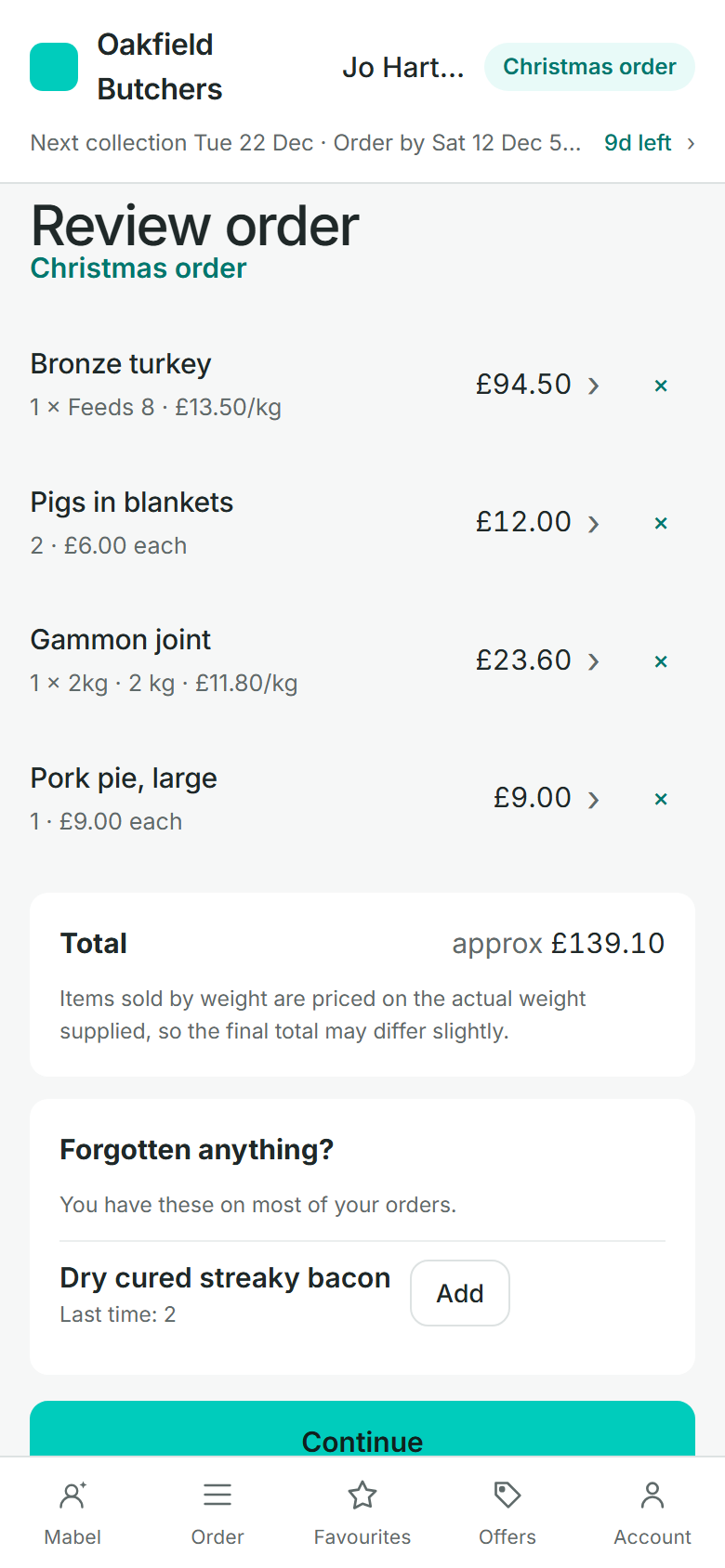 Review order, a Christmas order: a Bronze turkey, Feeds 8; two packs of pigs in blankets; a 2kg gammon joint and a large pork pie, approx £139.10. Then Forgotten anything?, with dry cured streaky bacon and an Add button